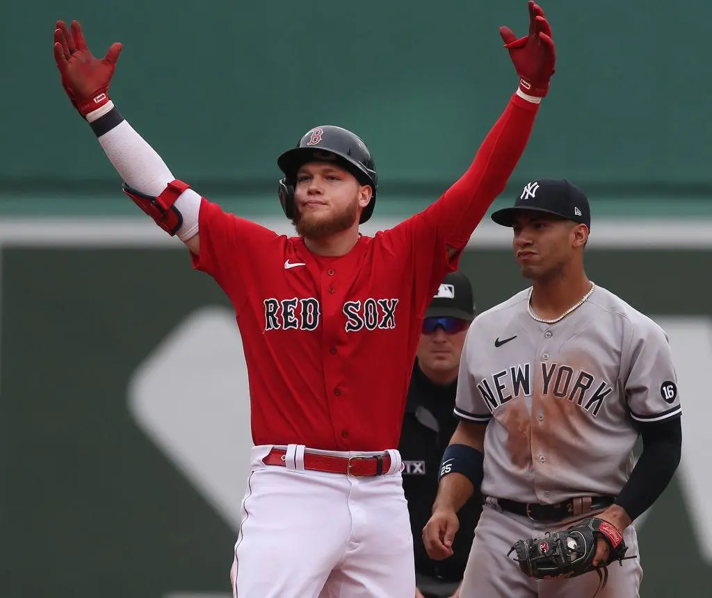 BOSTON MA. - JULY 25: Boston Red Sox left fielder Alex Verdugo reacts after hitting a double, spoiling a no-hitter by New York Yankees starting pitcher Domingo German, during the 8th inning of the game at Fenway Park on July 25, 2021 in Boston, MA