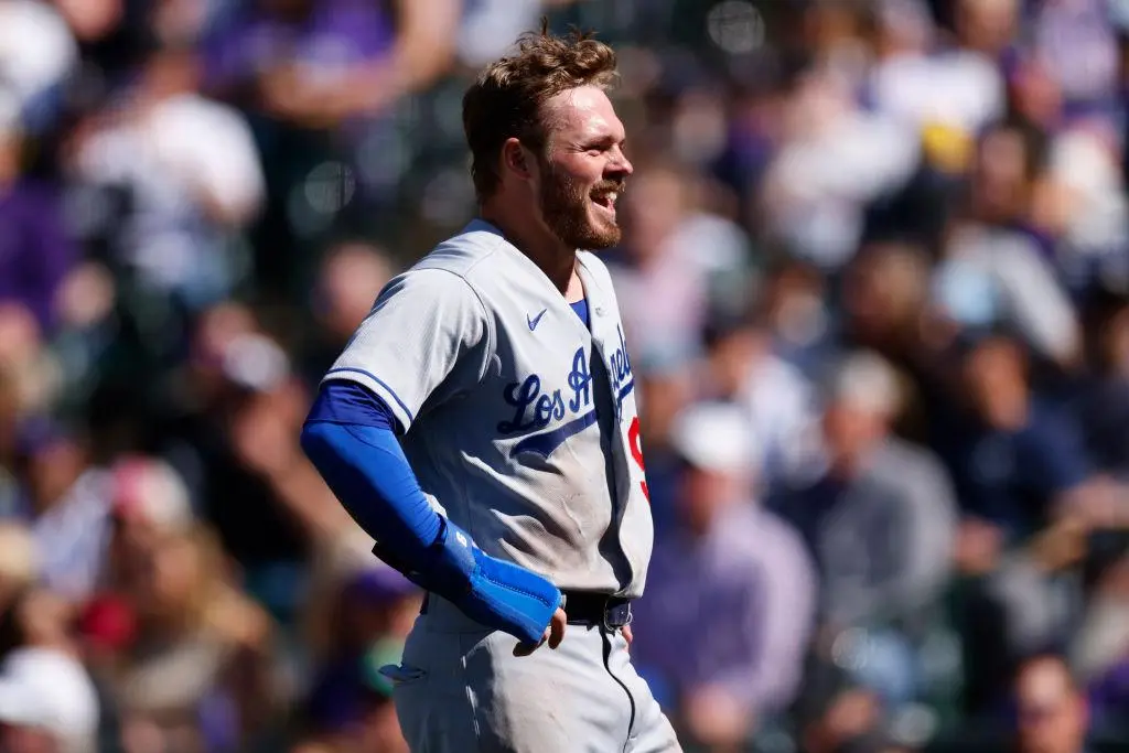 DENVER, CO - APRIL 8: Gavin Lux #9 of the Los Angeles Dodgers smiles on his way to the dugout after scoring on a double off the bat of Mookie Betts in the fourth inning against the Colorado Rockies on Opening Day at Coors Field on April 8, 2022 in Denver, Colorado