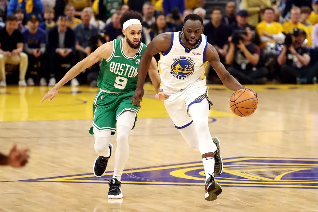 SAN FRANCISCO, CALIFORNIA - JUNE 02: Draymond Green #23 of the Golden State Warriors dribbles against Derrick White #9 of the Boston Celtics during the first quarter in Game One of the 2022 NBA Finals at Chase Center on June 02, 2022 in San Francisco, California.