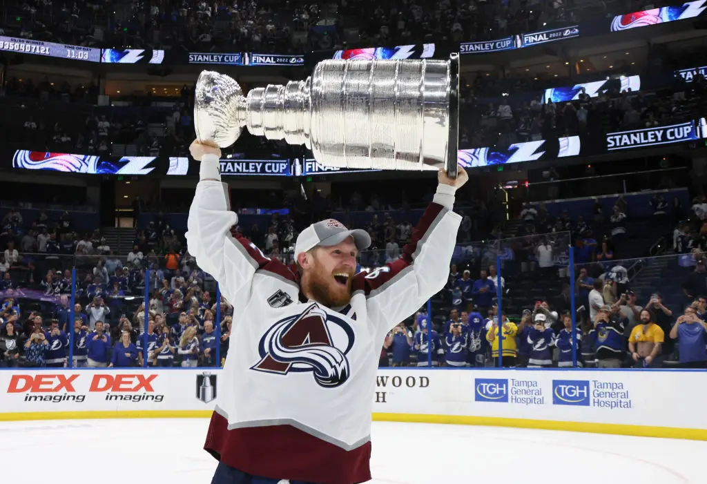 TAMPA, FLORIDA - JUNE 26: Gabriel Landeskog #92 of the Colorado Avalanche carries the Stanley Cup following the series winning victory over the Tampa Bay Lightning in Game Six of the 2022 NHL Stanley Cup Final at Amalie Arena on June 26, 2022 in Tampa, Florida