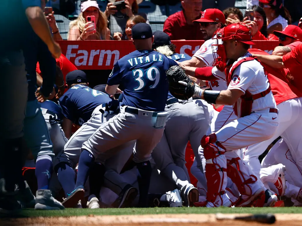 ANAHEIM, CALIFORNIA - JUNE 26: The Seattle Mariners and the Los Angeles Angels clear the benches after Jesse Winker #27 of the Seattle Mariners charged the Angels dugout after being hit by a pitch in the second inning at Angel Stadium of Anaheim on June 26, 2022 in Anaheim, California