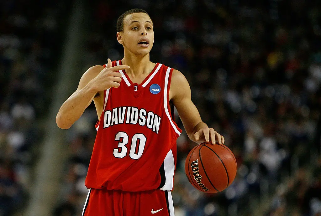 DETROIT - MARCH 30: Stephen Curry #30 of the Davidson Wildcats directs the offense against the Kansas Jayhawks during the Midwest Regional Final of the 2008 NCAA Division I Men's Basketball Tournament at Ford Field on March 30, 2008 in Detroit, Michigan. Kansas won 59-57