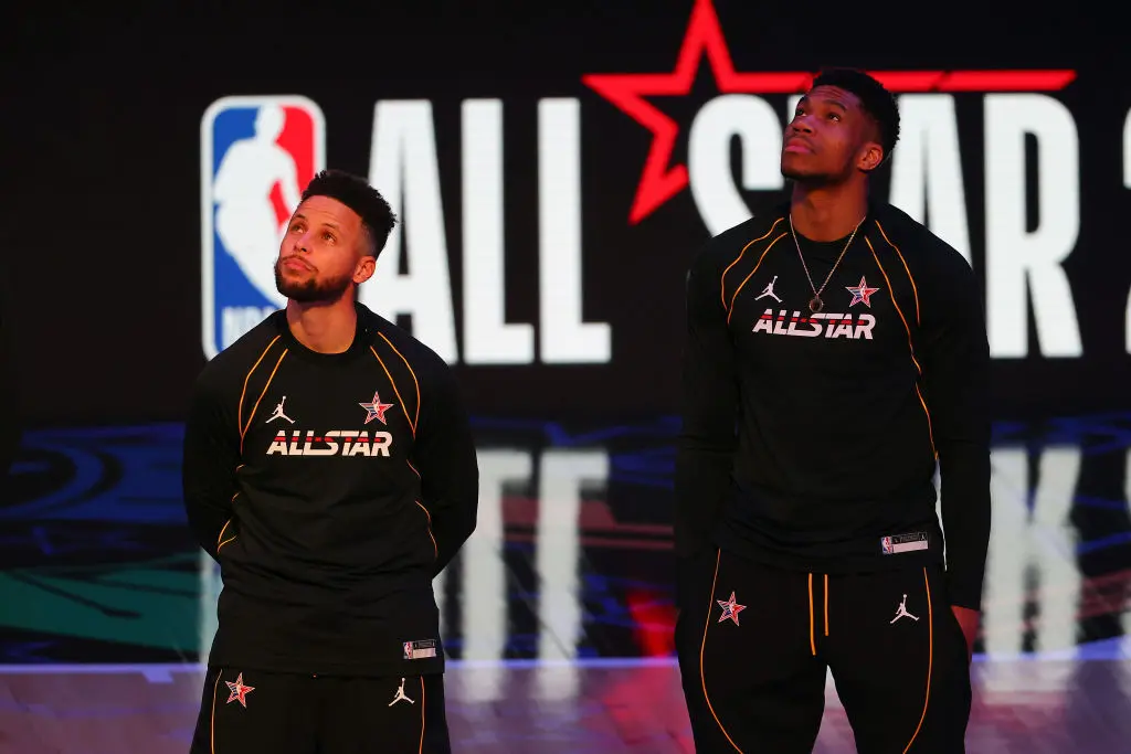 ATLANTA, GEORGIA - MARCH 07: Stephen Curry #30 and Giannis Antetokounmpo #34 of Team LeBron look on prior to the 70th NBA All-Star Game at State Farm Arena on March 07, 2021 in Atlanta, Georgia.