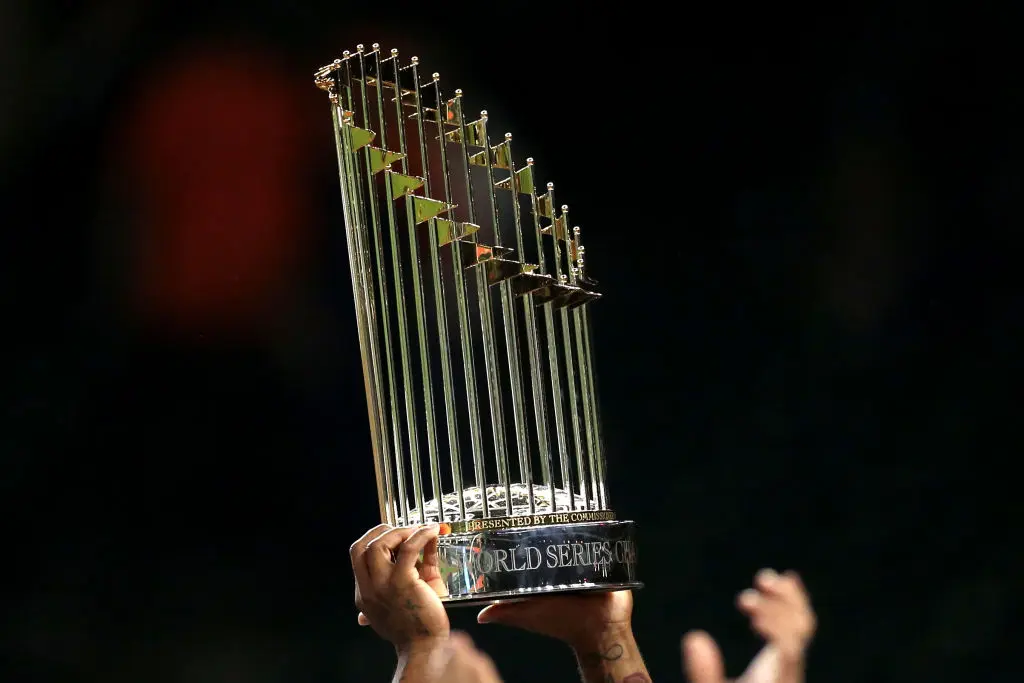 HOUSTON, TX - OCTOBER 30: Members of the Washington Nationals celebrate with the Commissioner's Trophy after the Nationals defeated the Houston Astros in Game 7 to win the 2019 World Series at Minute Maid Park on Wednesday, October 30, 2019 in Houston, Texas