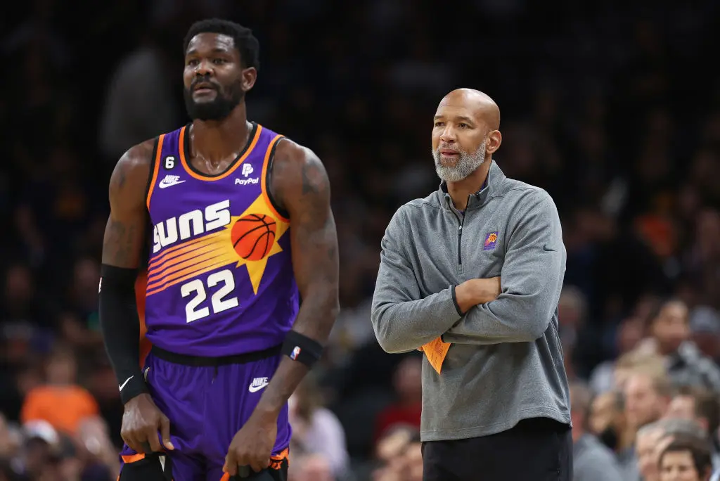 PHOENIX, ARIZONA - OCTOBER 25: Head coach Monty Williams (R) of the Phoenix Suns stands with Deandre Ayton #22 during the second half of the NBA game at Footprint Center on October 25, 2022 in Phoenix, Arizona. The Suns defeated the Warriors 134-105.