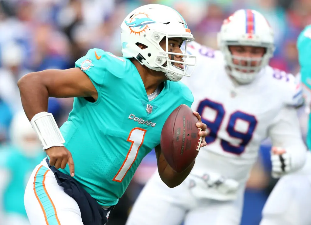 ORCHARD PARK, NEW YORK - OCTOBER 31: Tua Tagovailoa #1 of the Miami Dolphins scrambles in the third quarter against the Buffalo Bills at Highmark Stadium on October 31, 2021 in Orchard Park, New York