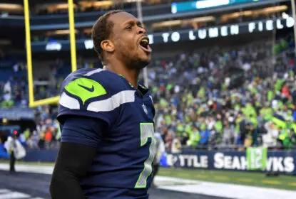 SEATTLE, WASHINGTON - JANUARY 08: Geno Smith #7 of the Seattle Seahawks celebrates after defeating the Los Angeles Rams in overtime at Lumen Field on January 08, 2023 in Seattle, Washington