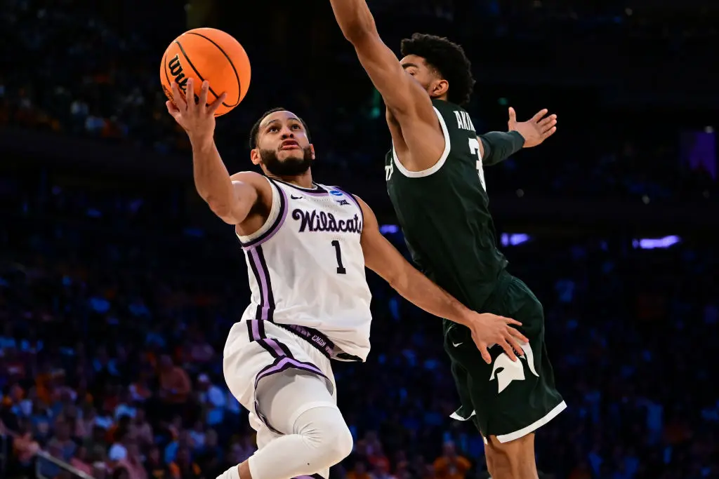 NEW YORK, NEW YORK - MARCH 23: Markquis Nowell #1 of the Kansas State Wildcats goes up for a layup guarded by Jaden Akins #3 of the Michigan State Spartans during overtime of the game during the Sweet Sixteen round of the 2023 NCAA Men's Basketball Tournament held at Madison Square Garden on March 23, 2023 in New York City