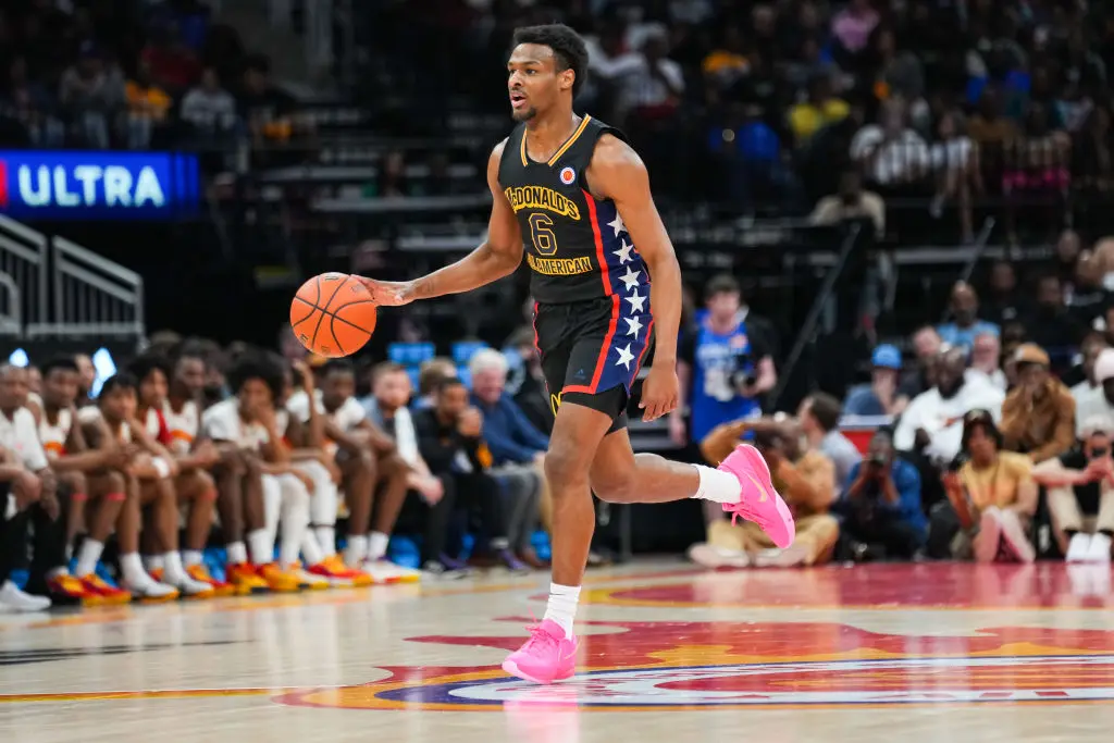 HOUSTON, TEXAS - MARCH 28: Bronny James #6 of the West team dribbles the ball during the 2023 McDonald's High School Boys All-American Game at Toyota Center on March 28, 2023 in Houston, Texas.