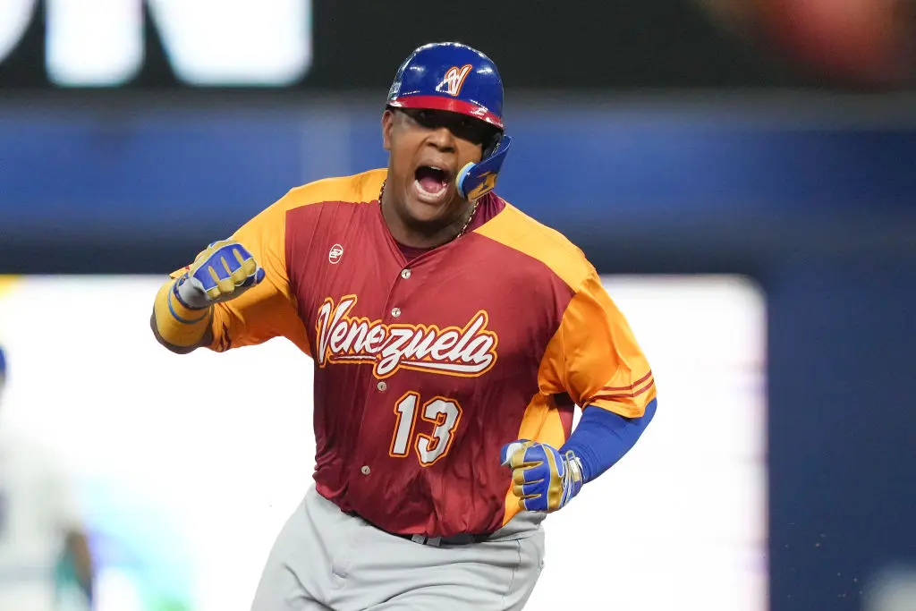 MIAMI, FLORIDA - MARCH 12: Salvador Perez #13 of Venezuela celebrates while rounding the bases after Anthony Santander hit a three run home run in the first inning against Puerto Rico at loanDepot park on March 12, 2023 in Miami, Florida