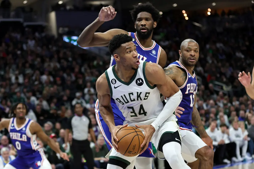 MILWAUKEE, WISCONSIN - APRIL 02: Giannis Antetokounmpo #34 of the Milwaukee Bucks is defended by Joel Embiid #21 of the Philadelphia 76ers during the first half of a game at Fiserv Forum on April 02, 2023 in Milwaukee, Wisconsin.