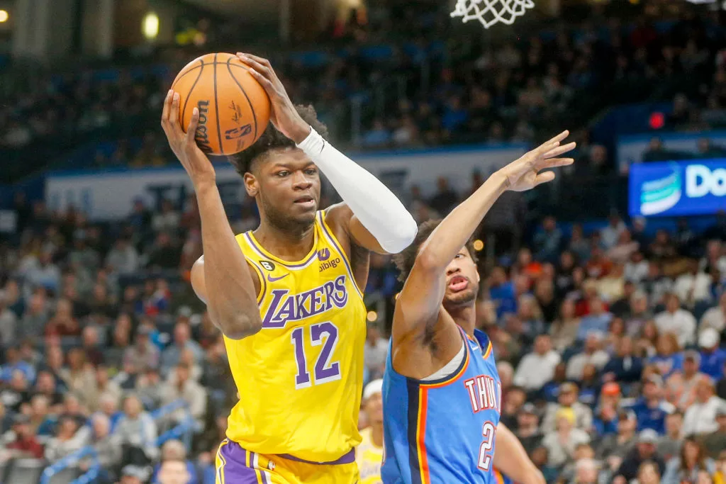 OKLAHOMA CITY, OKLAHOMA - MARCH 01: Mo Bamba #12 of the Los Angeles Lakers grabs a rebound over Aaron Wiggins #21 of the Oklahoma City Thunder during the second quarter at Paycom Center on March 01, 2023 in Oklahoma City, Oklahoma.