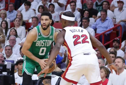 MIAMI, FLORIDA - MAY 23: Jayson Tatum #0 of the Boston Celtics controls the ball ahead of Jimmy Butler #22 of the Miami Heat during the first quarter in game four of the Eastern Conference Finals at Kaseya Center on May 23, 2023 in Miami, Florida.