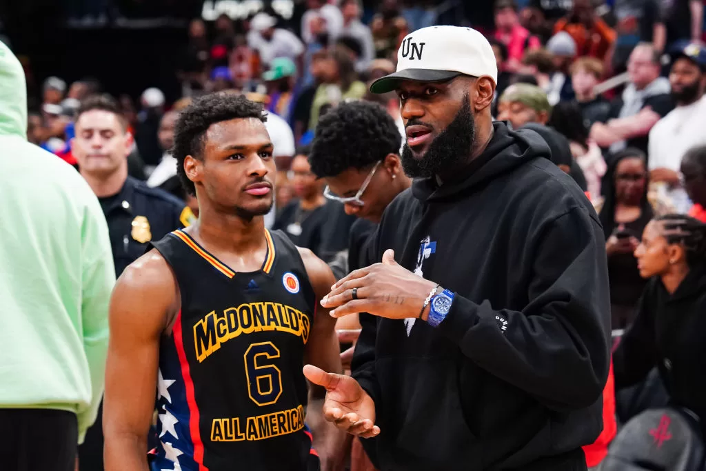 HOUSTON, TEXAS - MARCH 28: Bronny James #6 of the West team talks to Lebron James of the Los Angeles Lakers after the 2023 McDonald's High School Boys All-American Game at Toyota Center on March 28, 2023 in Houston, Texas.
