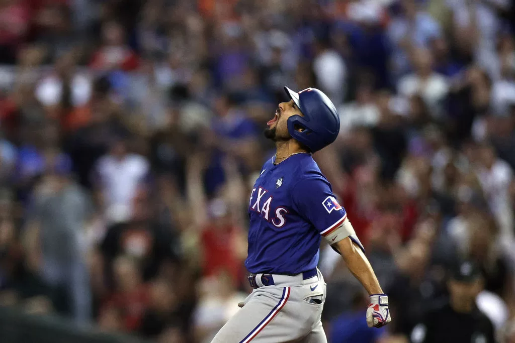 PHOENIX, ARIZONA - NOVEMBER 01: Marcus Semien #2 of the Texas Rangers rounds the bases after hitting a home run in the ninth inning against the Arizona Diamondbacks during Game Five of the World Series at Chase Field on November 01, 2023 in Phoenix, Arizona