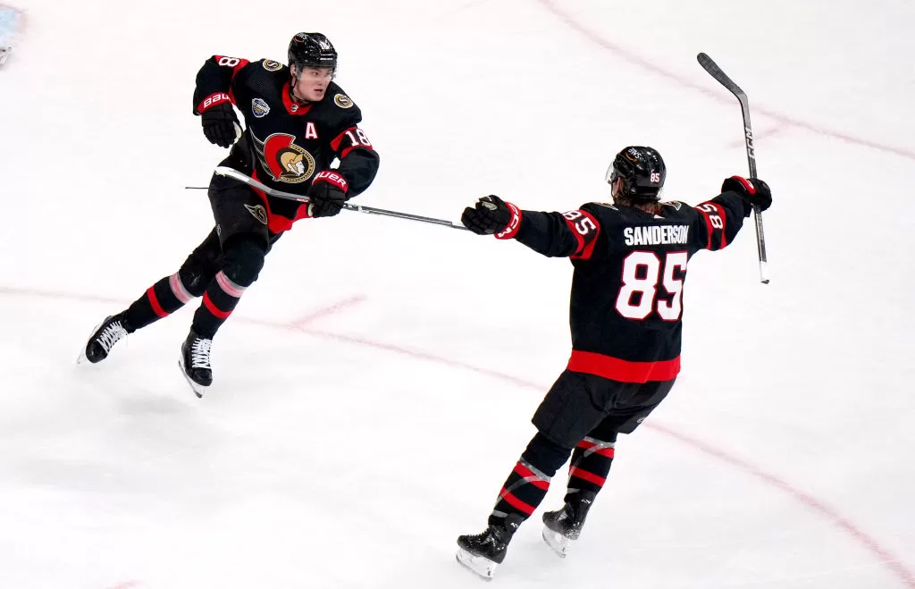 STOCKHOLM, SWEDEN - NOVEMBER 16: Jake Sanderson #85 and Tim Stutzle #18 of the Ottawa Senators react after Stutzle scored in the overtime period of the 2023 NHL Global Series in Sweden between the Detroit Red Wings and the Ottawa Senators at Avicii Arena on November 16, 2023 in Stockholm, Sweden.