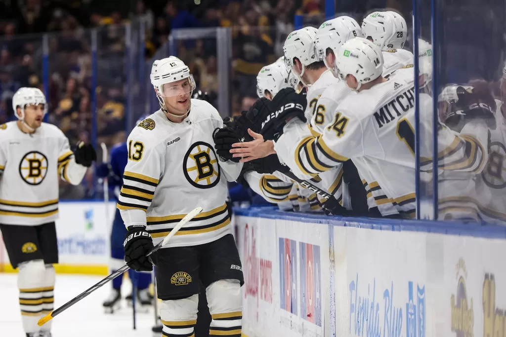 TAMPA, FL - NOVEMBER 20: Charlie Coyle #13 of the Boston Bruins celebrates a goal against the Tampa Bay Lightning during the third period at Amalie Arena on November 20, 2023 in Tampa, Florida