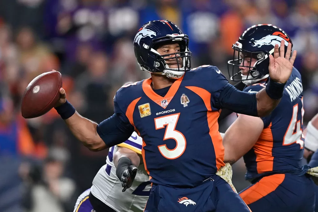 DENVER, COLORADO - NOVEMBER 19: Quarterback Russell Wilson #3 of the Denver Broncos throws a deep pass during the second quarter of the NFL game against the Minnesota Vikings at Empower Field At Mile High on November 19, 2023 in Denver, Colorado.