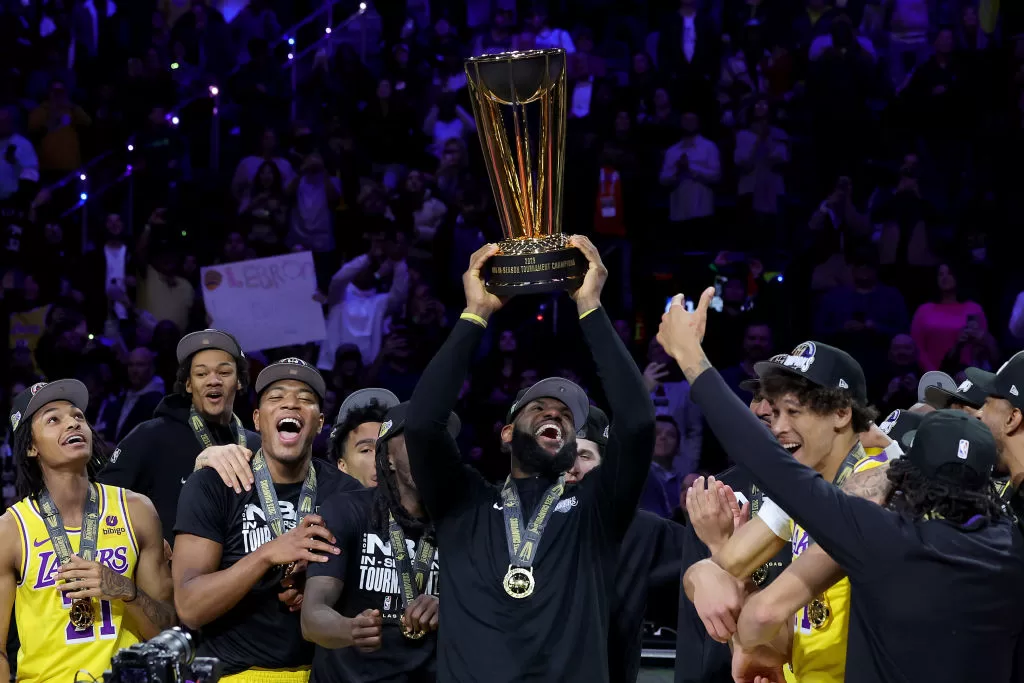 LAS VEGAS, NEVADA - DECEMBER 09: LeBron James #23 of the Los Angeles Lakers hoists the trophy with his teammates after winning the championship game of the inaugural NBA In-Season Tournament at T-Mobile Arena on December 09, 2023 in Las Vegas, Nevada.