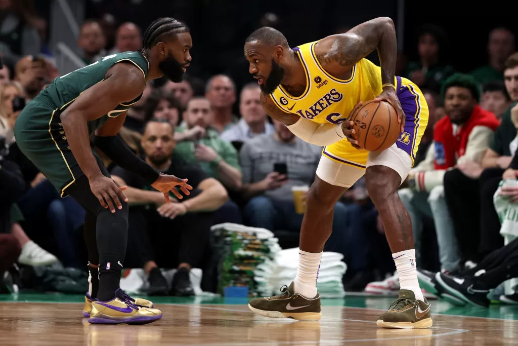 BOSTON, MASSACHUSETTS - JANUARY 28: Jaylen Brown #7 of the Boston Celtics defends LeBron James #6 of the Los Angeles Lakers during the first half at TD Garden on January 28, 2023 in Boston, Massachusetts.