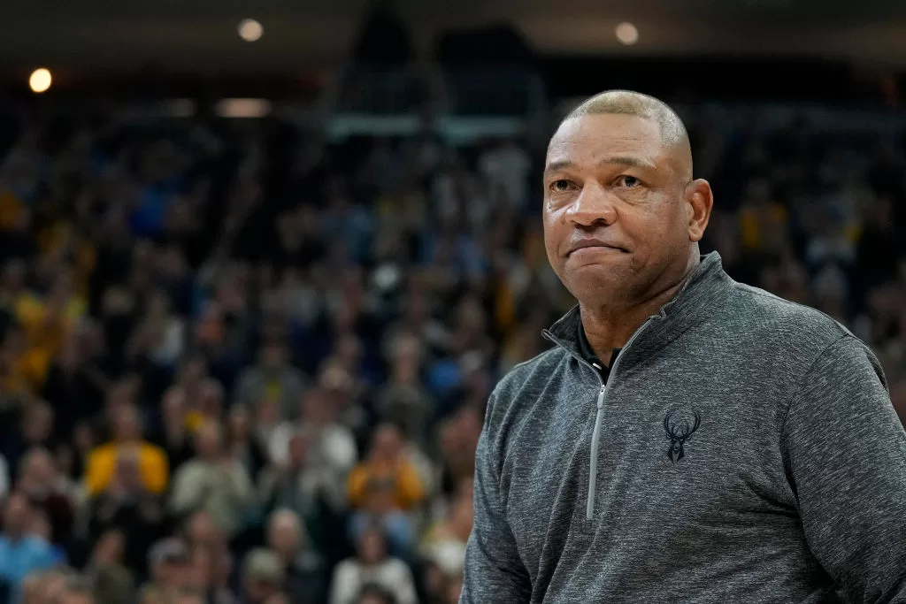MILWAUKEE, WISCONSIN - JANUARY 27: Head coach Doc Rivers of the Milwaukee Bucks speaks to the crowd in the first half of the game between the Seton Hall Pirates and Marquette Golden Eagles at Fiserv Forum on January 27, 2024 in Milwaukee, Wisconsin