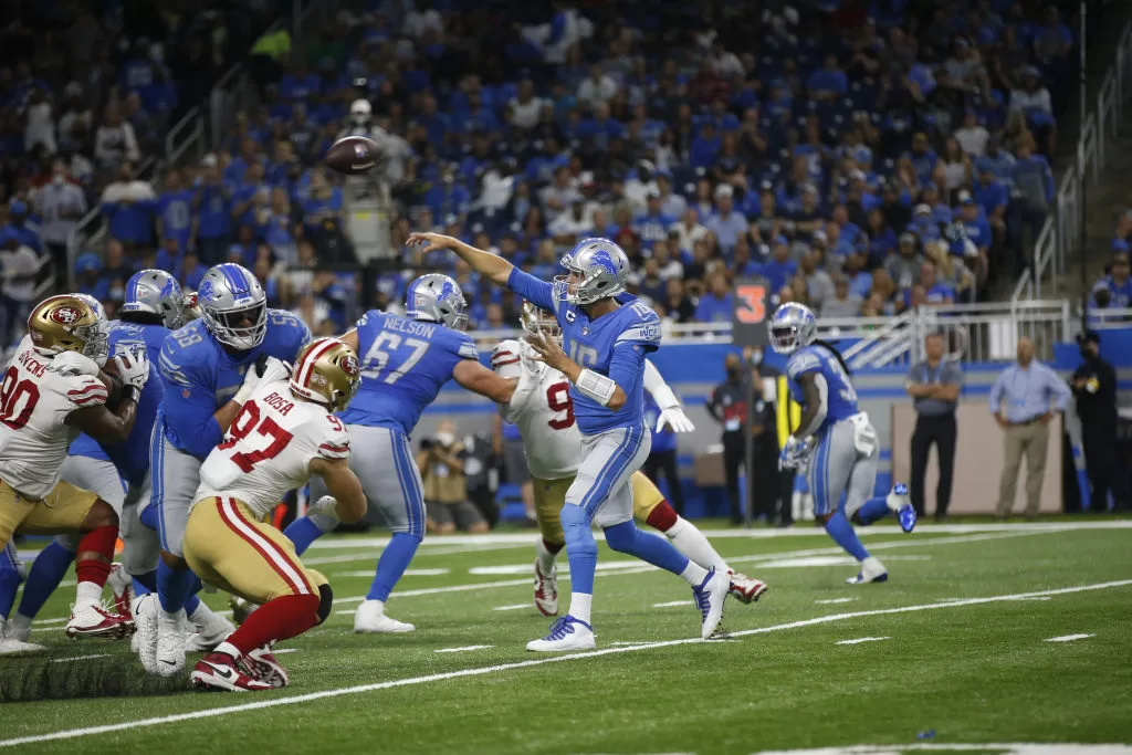 DETROIT, MI - SEPTEMBER 12: Jared Goff #16 of the Detroit Lions passes for a 6-yard touchdown during the game against the San Francisco 49ers at Ford Field on September 12, 2021 in Detroit, Michigan. The 49ers defeated the Lions 41-33.