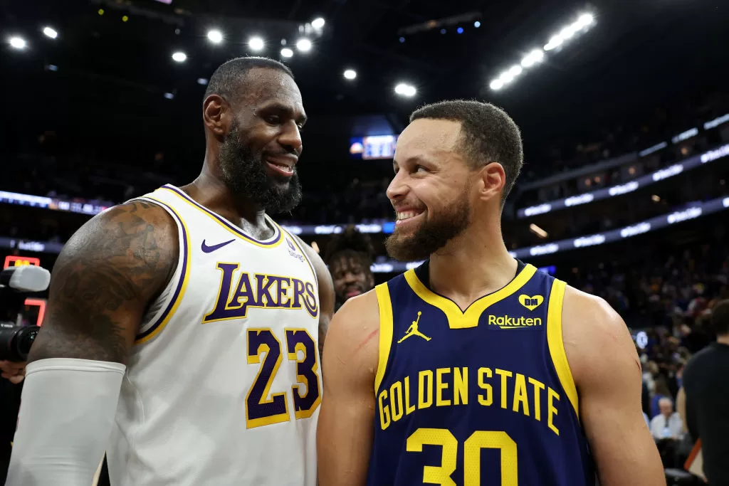 SAN FRANCISCO, CALIFORNIA - JANUARY 27: LeBron James #23 of the Los Angeles Lakers and Stephen Curry #30 of the Golden State Warriors talk to each other after the Lakers beat the Warriors in double overtime at Chase Center on January 27, 2024 in San Francisco, California.