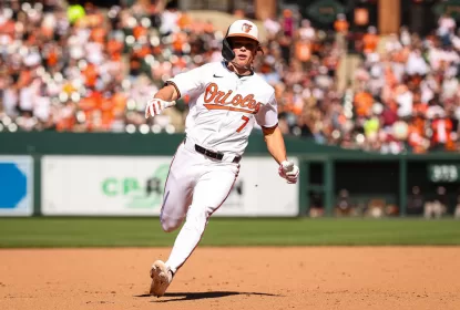 BALTIMORE, MD - APRIL 14: Jackson Holliday #7 of the Baltimore Orioles advances to third base during the seventh inning against the Milwaukee Brewers at Oriole Park at Camden Yards on April 14, 2024 in Baltimore, Maryland.