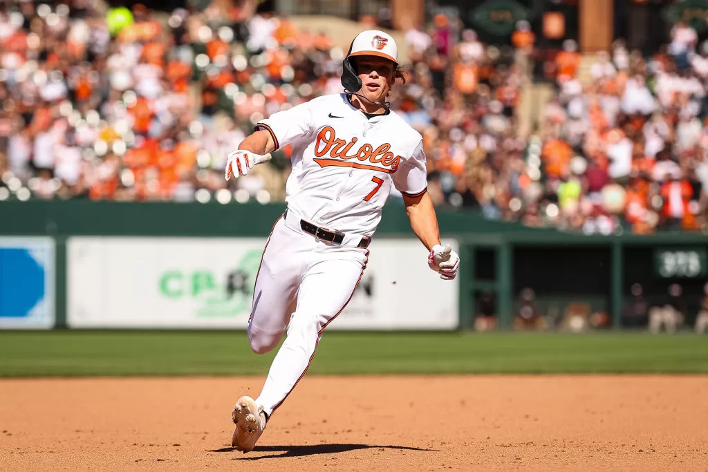 BALTIMORE, MD - APRIL 14: Jackson Holliday #7 of the Baltimore Orioles advances to third base during the seventh inning against the Milwaukee Brewers at Oriole Park at Camden Yards on April 14, 2024 in Baltimore, Maryland.
